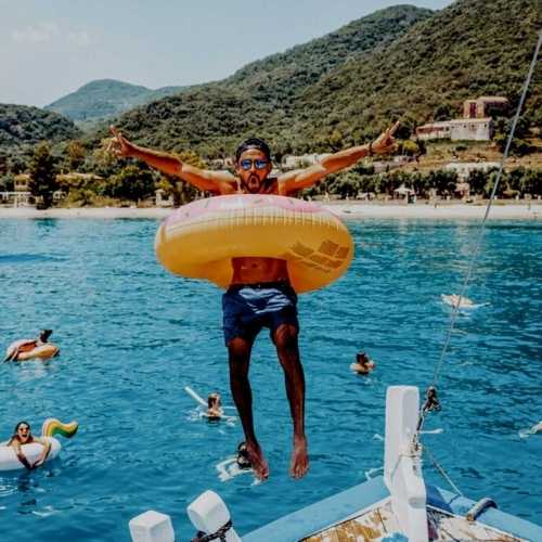 guy goes for a swim in floatie tube