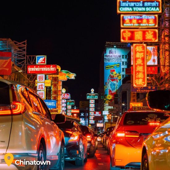 lights from cars and signs on chinatown street in Bangkok Thailand