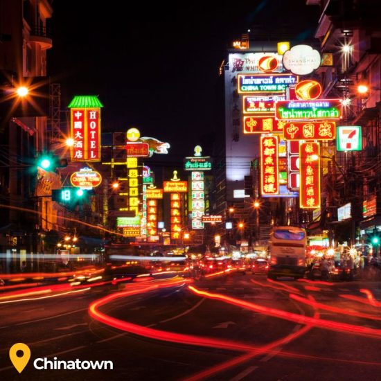 lights from cars and signs on chinatown street in Bangkok Thailand