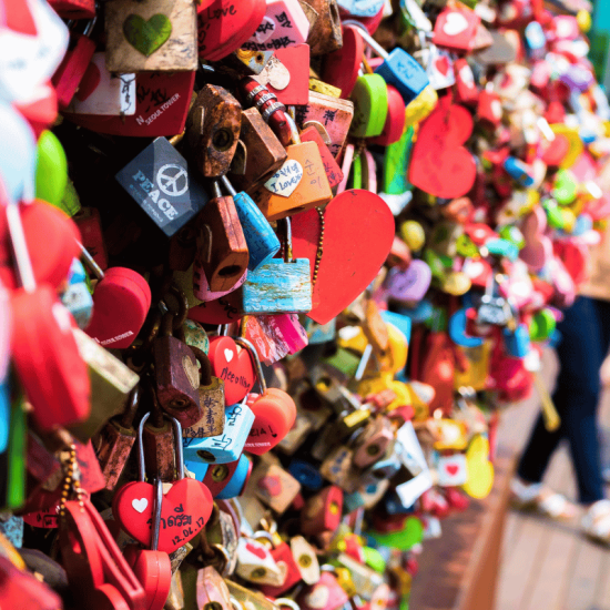 Colorful love locks on a fence.