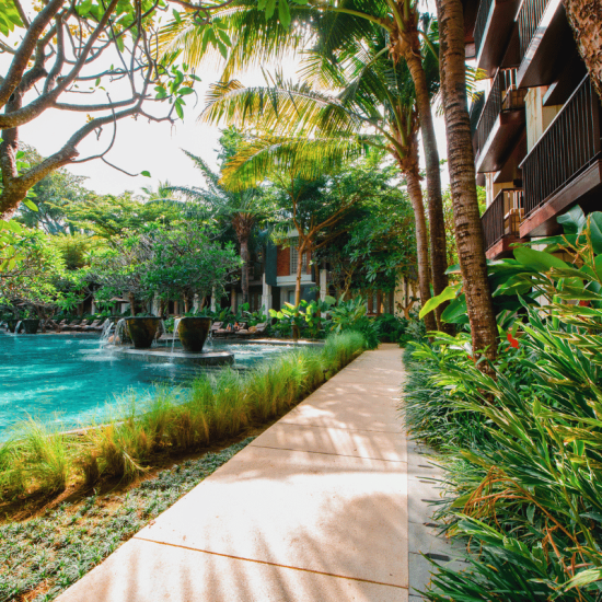 Ramayana Lush tropical pathway by pool
